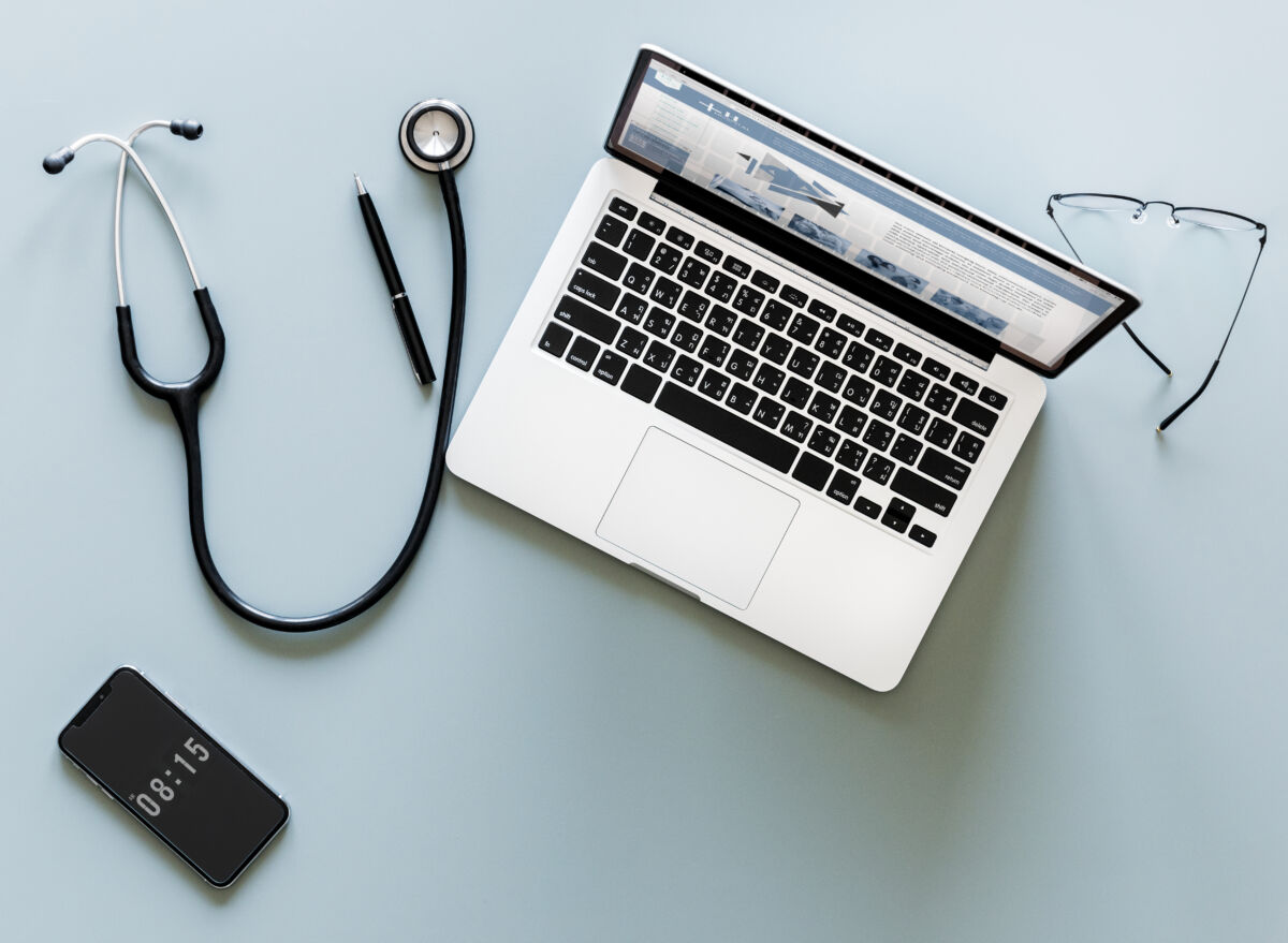 Aerial view of doctor stethoscope and computer laptop