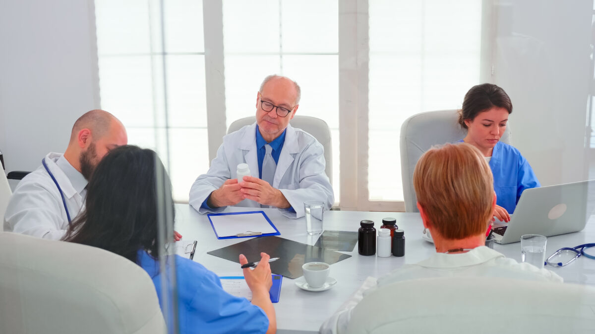 Concentrated medical team discussing looking for solutions together